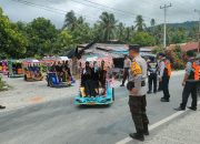 Puluhan Personel Polres Touna Kawal Kegiatan Karnaval Roda Hias Meriahkan HUT Touna Ke-21