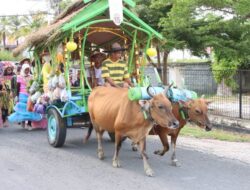 Semarak Peringatan HUT Touna ke-22: Kapolres dan Ketua Bhayangkari Ikut Arak-arakan Gerobak Hias Sapi!