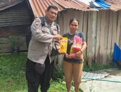 Ringankan Beban Masyarakat, Sat Binmas Polres Touna Berbagi Sembako di Ratolindo